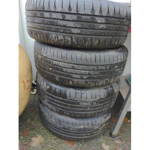 145 - Four Nissan alloy wheels and tyres 205 55 R16 