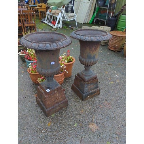 28 - Pair of large classical cast iron fluted urns with cast base.  Height 90 cm Dia 49 cm to top