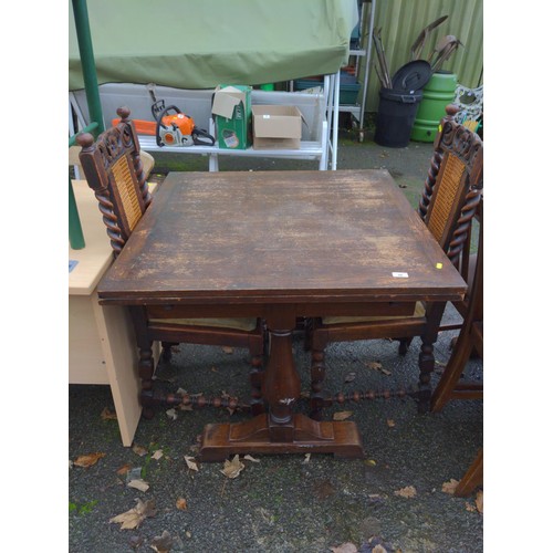 34 - Oak extending table with 2 cane back chairs