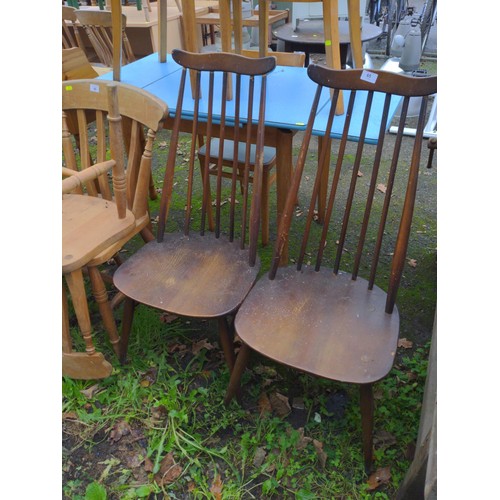 65 - Pair of Ercol Goldsmith chairs, dark finish. Attention required to spindles.