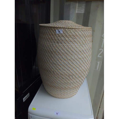 94 - Wicker laundry basket with lid. H58cm