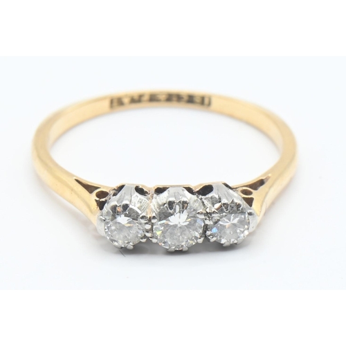 656 - 18ct gold and diamond trilogy ring featuring three brilliant cut diamonds mounted in platinum, size ... 