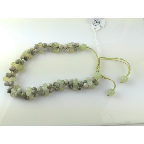 671 - Celadon jade and hardstone bead necklace, 46cm circumference (adjustable)