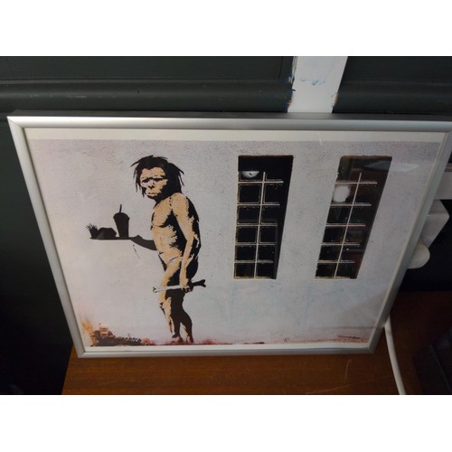 530 - Two framed Banksy prints 29 x 36cm