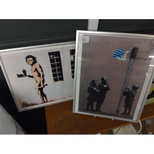 530 - Two framed Banksy prints 29 x 36cm