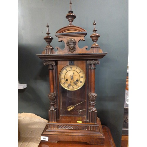 415 - Large carved German mantel clock with detail of finials, columns, and carved lady to top of clock. H... 