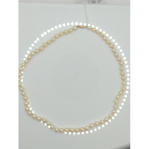 662 - Single strand cultured pearl necklace with a 9ct gold marked clasp. Length 920mm. Weight 22g