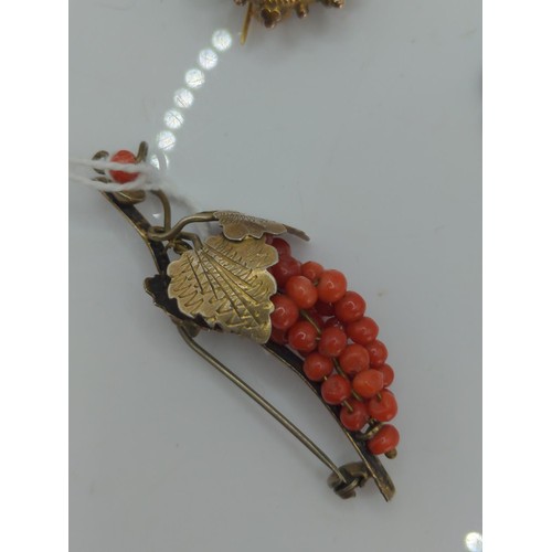 666 - 800 silver and coral bead 'bunch of grapes' brooch, gold coloured mourning brooch and a copper colou... 