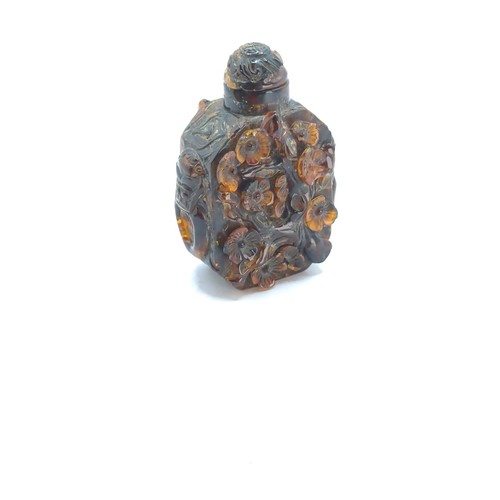 700 - Chinese carved amber snuff bottle decorated with prunus blossom (some losses), height 80mm