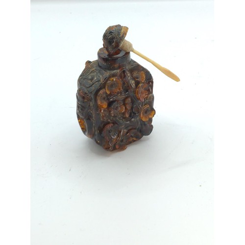 700 - Chinese carved amber snuff bottle decorated with prunus blossom (some losses), height 80mm