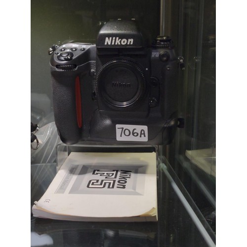 706A - Nikon F5 camera body with winder and instruction manual