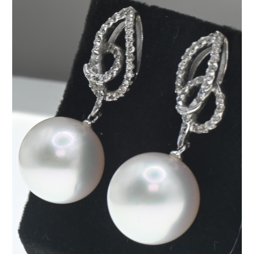 4 - Pair of 18ct white gold, diamond and pearl drop earrings, length 32mm, gross weight 9.1 grams