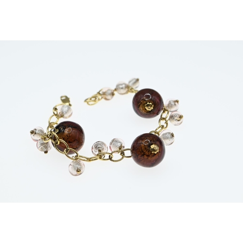 54 - 9ct gold and glass bead bracelet, circumference 195mm, gross weight 19.9 grams