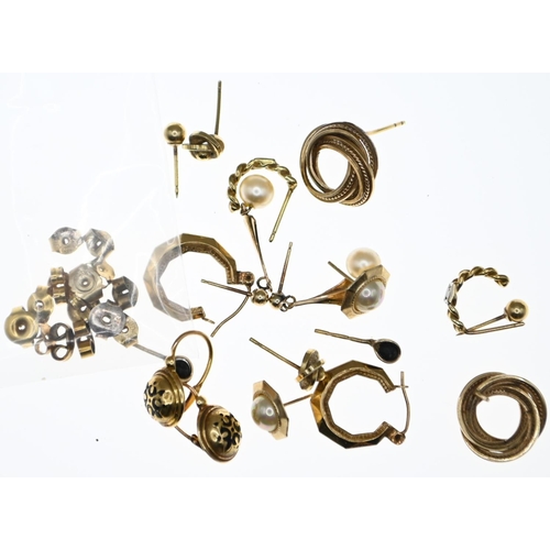 60 - Nine pairs of yellow metal earrings, including diamond set, together with 14 mismatched non gold but... 