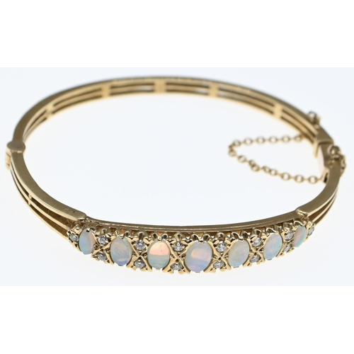 9ct gold, opal and diamond bangle, diameter 65mm, gross weight 14.69 grams