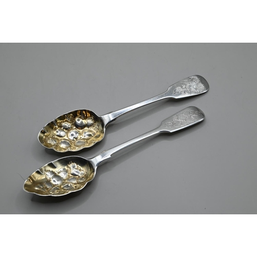 171 - Two silver and parcel-gilt fiddle pattern berry spoons, including one George III by IW Chester 1833 ... 