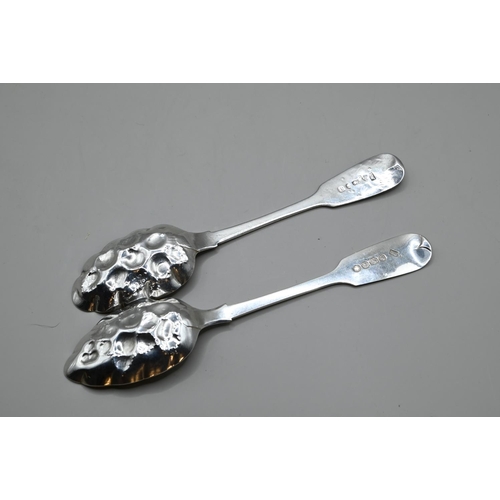 171 - Two silver and parcel-gilt fiddle pattern berry spoons, including one George III by IW Chester 1833 ... 