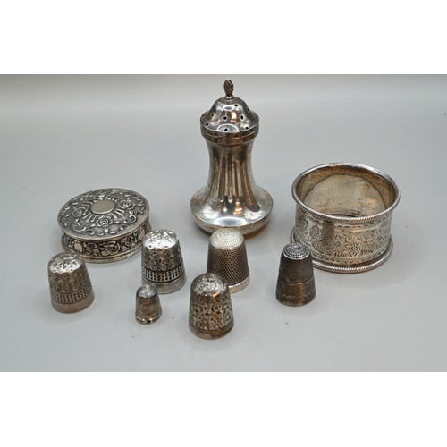 188 - Various silverware, including a late Victorian napkin ring (initialled), pepperette and three thimbl... 