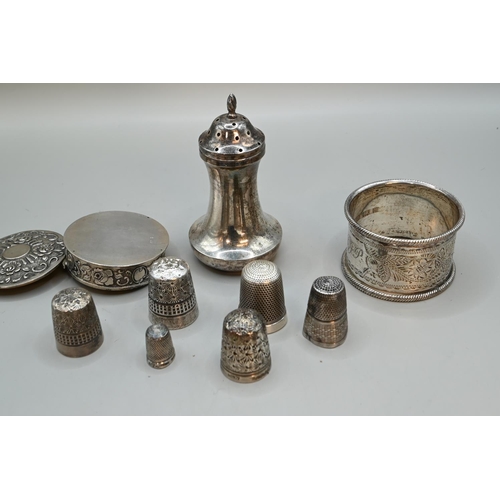 188 - Various silverware, including a late Victorian napkin ring (initialled), pepperette and three thimbl... 