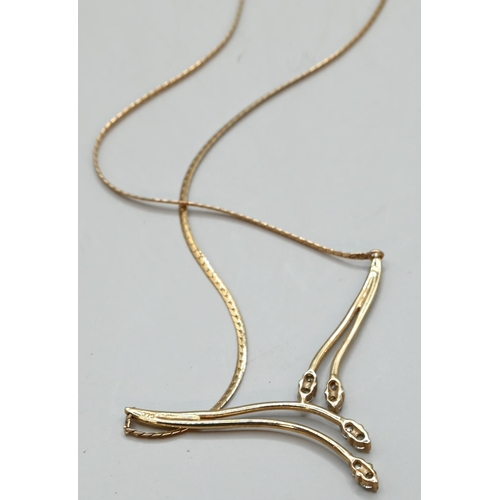 62A - 9ct gold flat snake pendant necklace, the pendant set with CZ, circumference approximately 440mm, gr... 