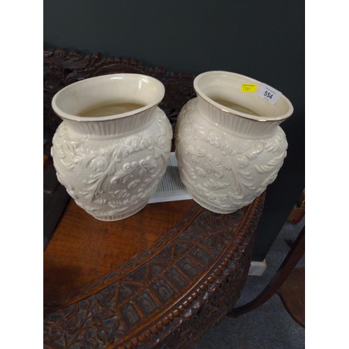 554 - Pair of cream vases decorated with floral motif, H24cm