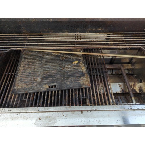 248A - Outback OUT370592 Signature 6 Burner BBQ. With internal grill and electric rotisserie, includes a si... 