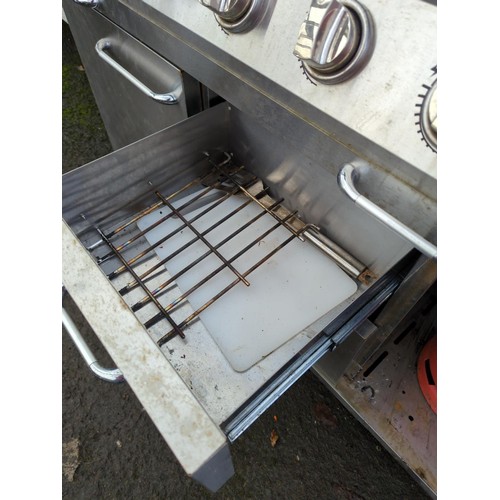 248A - Outback OUT370592 Signature 6 Burner BBQ. With internal grill and electric rotisserie, includes a si... 