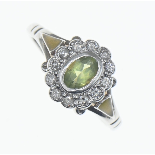 1026 - Peridot and diamond cluster ring mounted on a 14ct white gold shank, peridot 6mm x 4mm, size N1... 