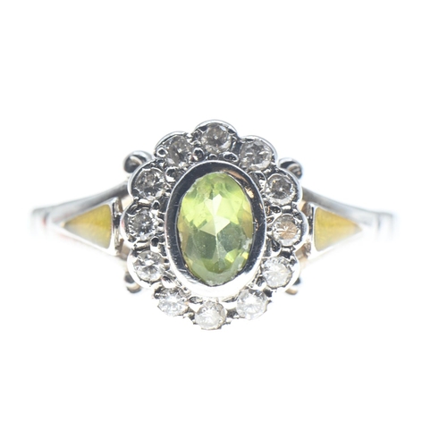 1026 - Peridot and diamond cluster ring mounted on a 14ct white gold shank, peridot 6mm x 4mm, size N1... 