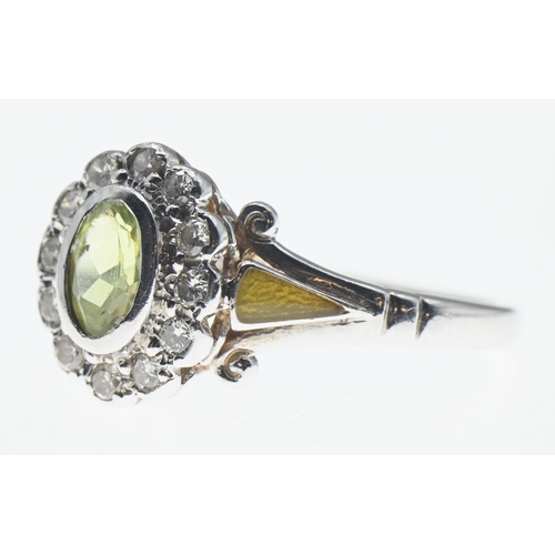 1026 - Peridot and diamond cluster ring mounted on a 14ct white gold shank, peridot 6mm x 4mm, size N1... 