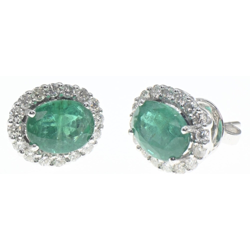 1027 - Pair of 18ct gold, emerald and diamond cluster earrings, length 18mm, gross weight 4.2 grams