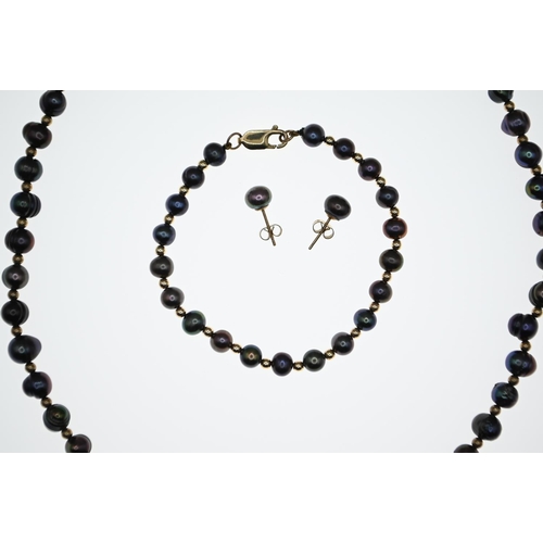 1052 - Tahitian off round circle pearl necklace with 14ct gold clasp, circumference 460mm, a bracelet with ... 