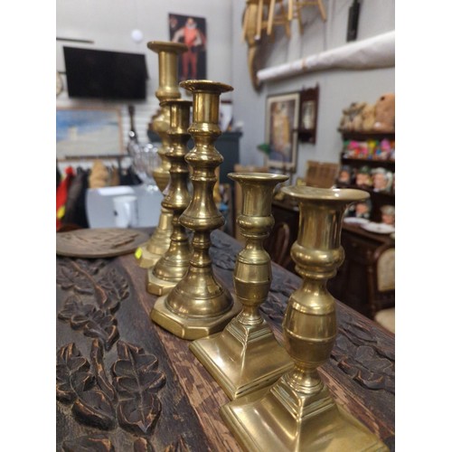 680A - 5 x brass candlesticks inc. 2 pairs 