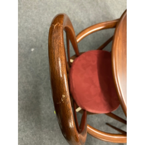 699 - Dark wood Ercol extending dining table with two dining chairs and two carver chairs. ( seat pads are... 