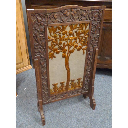 702 - Oak firescreen with tree decoration. H86cm