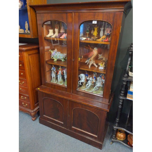 593 - Mahogany glazed bookcase with adjustable shelves and lower cupboard with key W96 D38 H155cm