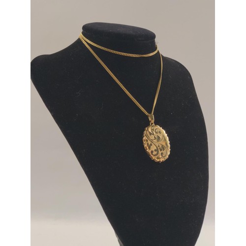 1051 - 9ct gold locket on a 9ct gold chain. Chain length 540mm  Gross weight 14.84g.