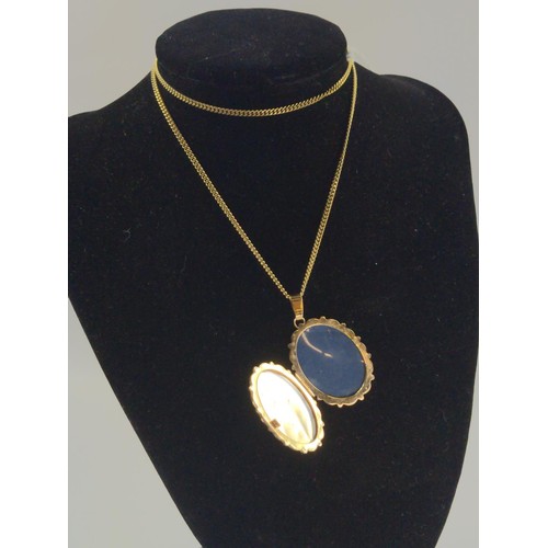 1051 - 9ct gold locket on a 9ct gold chain. Chain length 540mm  Gross weight 14.84g.