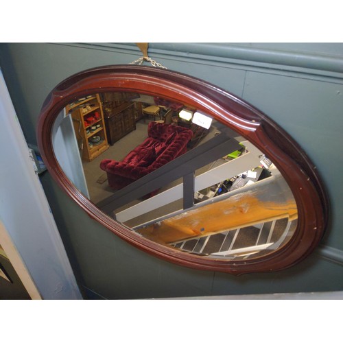 449 - Oval mahogany framed bevelled mirror 85 x 62cm