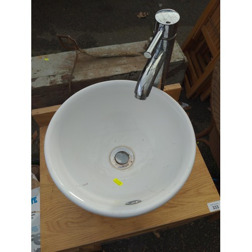 325 - Small round ceramic basin on wooden stand with tap and plumbing