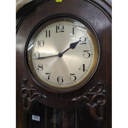 838 - Early C20 oak cased grandfather clock. With pendulum and weights. 197cm high