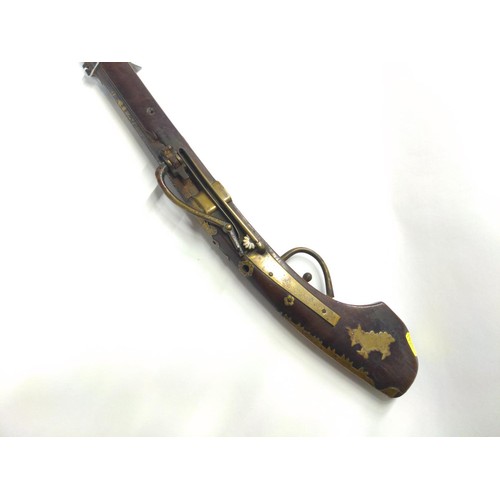 775 - Japanese matchlock rifle circa 1820 with inland brass scenes on barrel L. 135cm