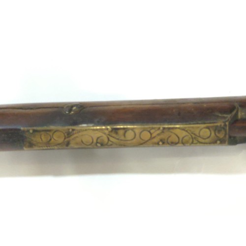 775 - Japanese matchlock rifle circa 1820 with inland brass scenes on barrel L. 135cm