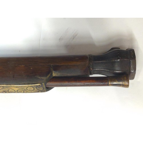 775 - Japanese matchlock rifle circa 1820 with inland brass scenes on barrel L. 135cm