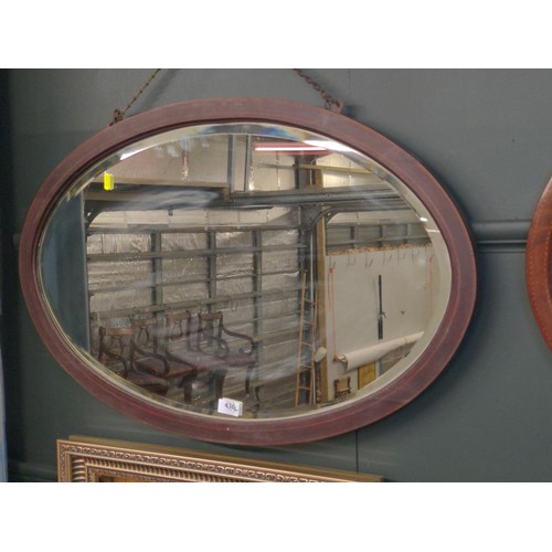 436 - Oval bevelled hardwood framed mirror. W84 H53 cm