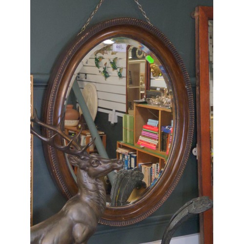 440 - Vintage oval bevelled edge mirror with inlaid trim. W49 H59 cm