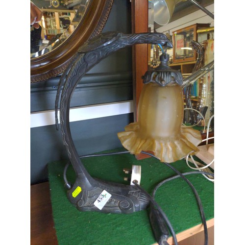 453 - Cast table lamp in the form of a swooping eagle and glass shade. H36 cm