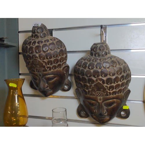 458 - Two carved head masks in Thai style. W22 H33 cm