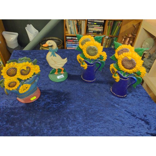 522 - 4x cast iron door stops, 3x with sunflowers