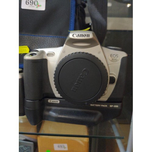 690 - Two Canon EOS 300 camera bodies one with motor battery pack, Canon 28-90mm zoom lens and large padde... 